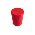 Closed red screw-top ampoule holder with a diamond-textured exterior.