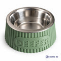 Personalised sage-green ribbed tapered pet bowl riser with the name DEEFER and a stainless-steel bowl.