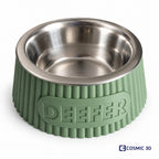 Personalised sage-green ribbed tapered pet bowl riser with the name DEEFER and a stainless-steel bowl.